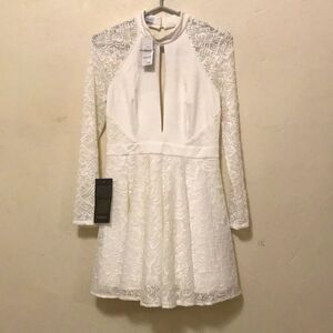 Bebe crème  long sleeve open back lace mini summer dress new w tags size medium